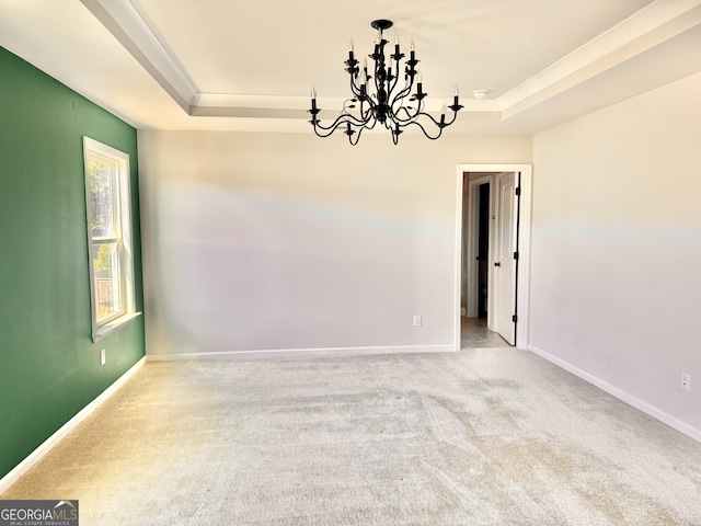 5599 Wheeler Ridge Rd, Auburn, GA 30011 - carpeted empty room with a raised ceiling and a chandelier