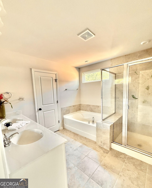5599 Wheeler Ridge Rd, Auburn, GA 30011 - full bathroom with a bath, a shower stall, double vanity, and tile patterned flooring
