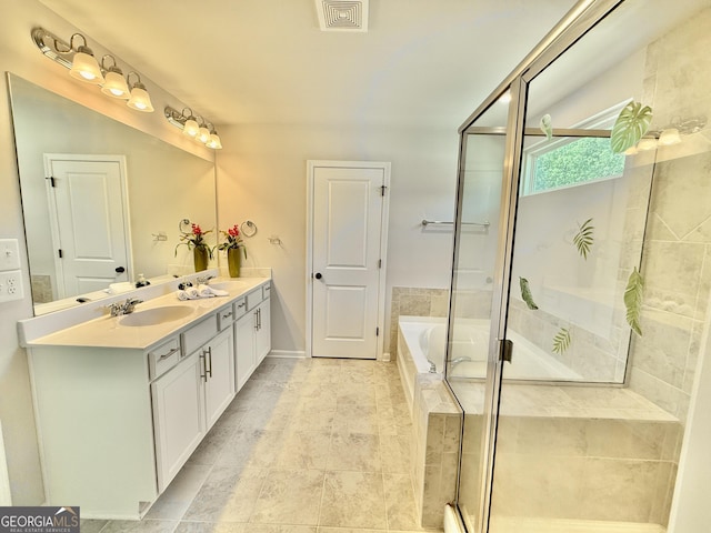 5599 Wheeler Ridge Rd, Auburn, GA 30011 - bathroom with double vanity, a bath, and a stall shower