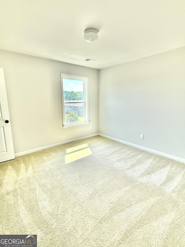 5599 Wheeler Ridge Rd, Auburn, GA 30011 - unfurnished room with light colored carpet and baseboards