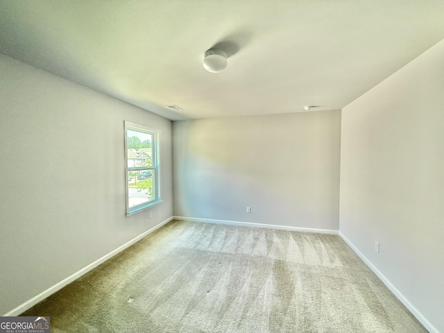 5599 Wheeler Ridge Rd, Auburn, GA 30011 - carpeted empty room featuring baseboards