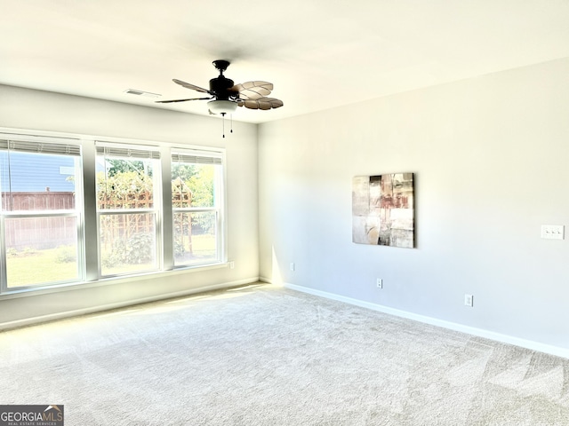 5599 Wheeler Ridge Rd, Auburn, GA 30011 - carpeted empty room with baseboards and ceiling fan