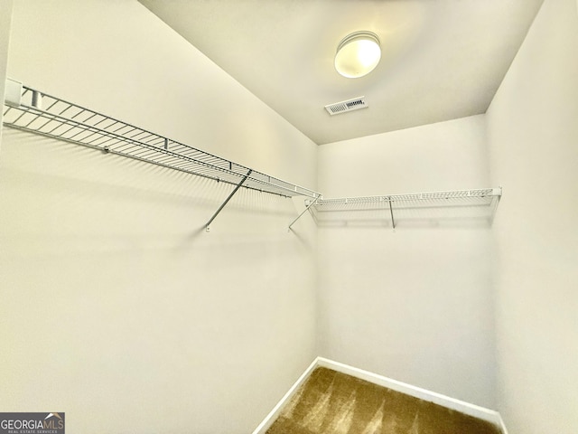 5599 Wheeler Ridge Rd, Auburn, GA 30011 - spacious closet featuring dark carpet