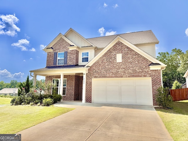 5599 Wheeler Ridge Rd, Auburn, GA 30011 - view of front of house featuring driveway, brick siding, an attached garage, and board and batten siding