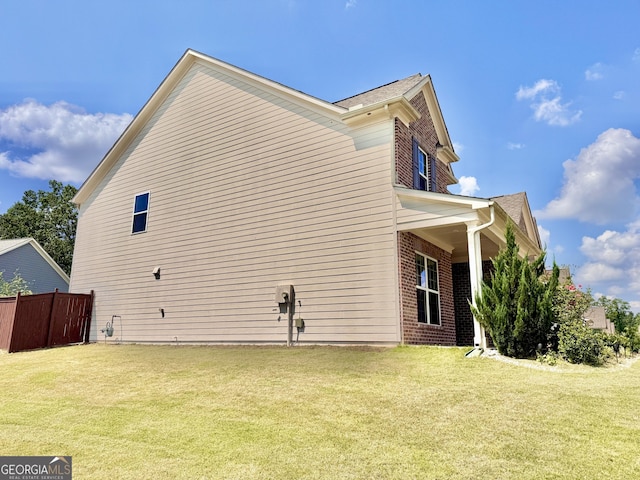 5599 Wheeler Ridge Rd, Auburn, GA 30011 - view of side of home featuring brick siding and a shingled roof