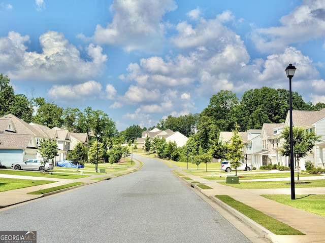 5599 Wheeler Ridge Rd, Auburn, GA 30011 - view of asphalt street featuring street lighting, sidewalks, and a residential view