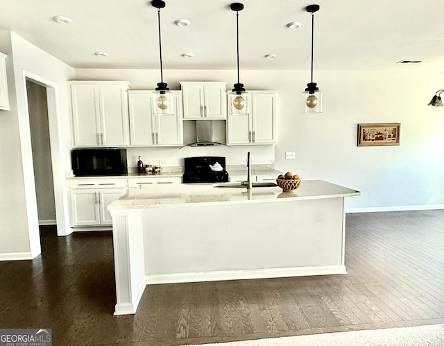 5599 Wheeler Ridge Rd, Auburn, GA 30011 - kitchen with range hood, stove, dark wood-style floors, and white cabinetry