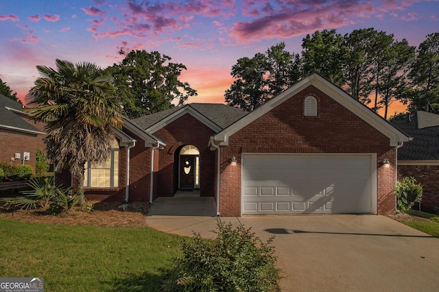 286 Prominent Loop, Mcdonough, GA 30253 - ranch-style house with brick siding, an attached garage, driveway, and a yard