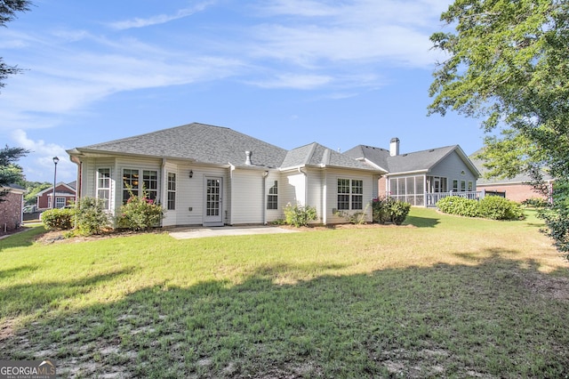 286 Prominent Loop, Mcdonough, GA 30253 - rear view of house with a lawn, a patio, and a sunroom