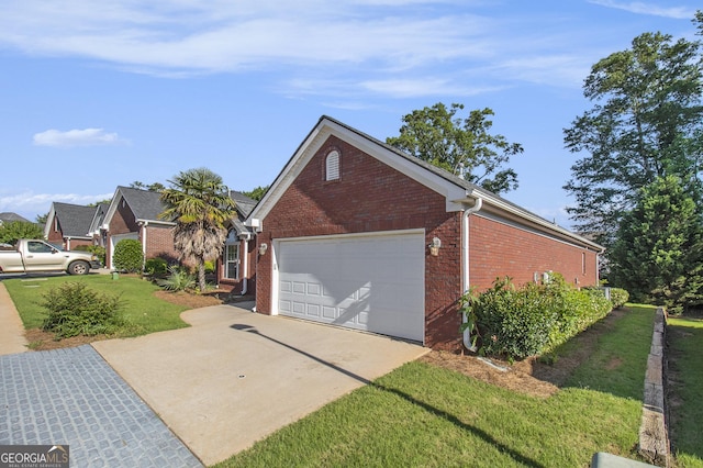286 Prominent Loop, Mcdonough, GA 30253 - view of home's exterior with brick siding, concrete driveway, an attached garage, and a lawn