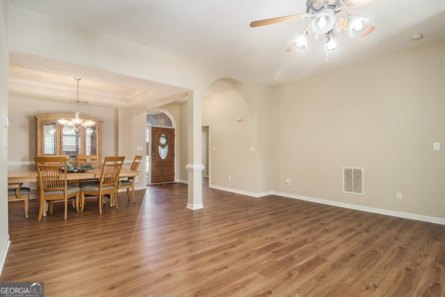 286 Prominent Loop, Mcdonough, GA 30253 - dining space featuring light wood-style flooring, arched walkways, ceiling fan, and a chandelier