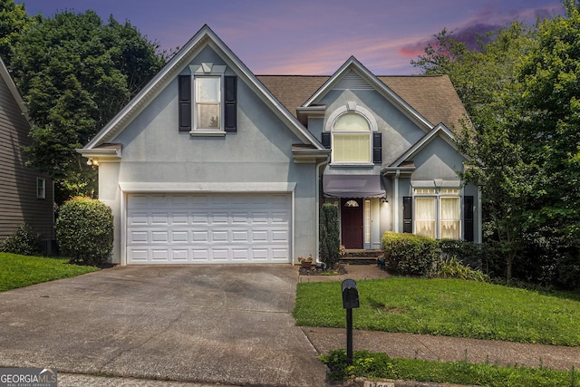 1469 Crescent Walk, Decatur, GA 30033 - traditional home featuring stucco siding, driveway, an attached garage, and a lawn