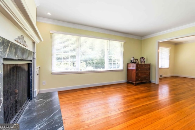 2628 Tanglewood Rd, Decatur, GA 30033 - living room featuring a premium fireplace, crown molding, and wood finished floors