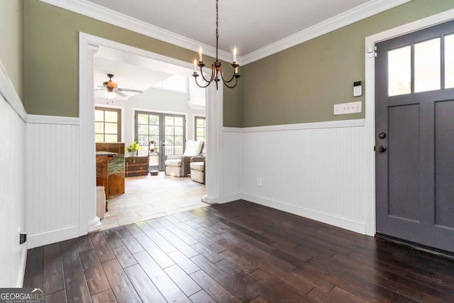 2628 Tanglewood Rd, Decatur, GA 30033 - foyer with wainscoting, ceiling fan, wood-type flooring, crown molding, and a chandelier