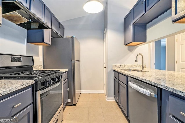 3918 S Creek Ct, Stone Mountain, GA 30083 - kitchen with stainless steel appliances, under cabinet range hood, light tile patterned floors, light stone counters, and lofted ceiling