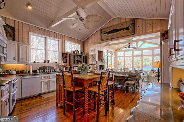 165 Pepe Rd, Clayton, GA 30525 - dining room with a ceiling fan, vaulted ceiling, wood finished floors, wood walls, and wood ceiling
