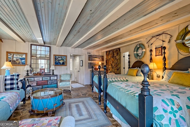 165 Pepe Rd, Clayton, GA 30525 - bedroom featuring beamed ceiling and stone finish floors