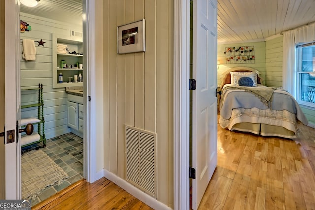 165 Pepe Rd, Clayton, GA 30525 - bedroom featuring wood walls, light wood-style flooring, and wood ceiling