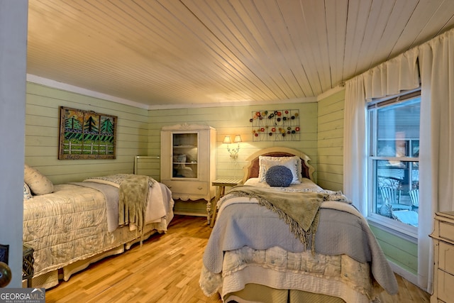 165 Pepe Rd, Clayton, GA 30525 - bedroom featuring wood walls, multiple windows, light wood-type flooring, and wooden ceiling