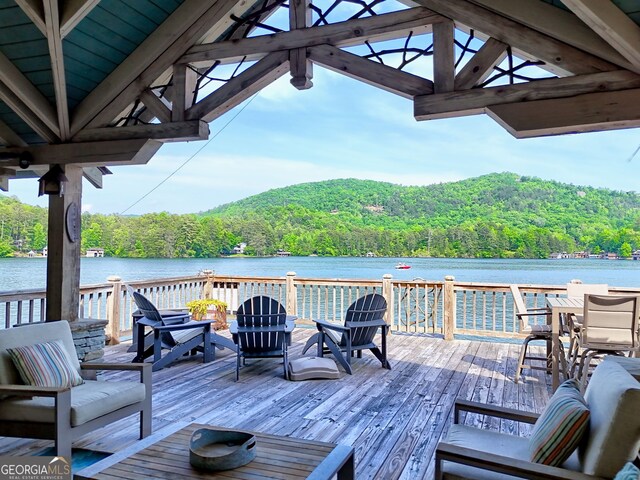 165 Pepe Rd, Clayton, GA 30525 - wooden deck with a forest view, a water view, and outdoor dining space