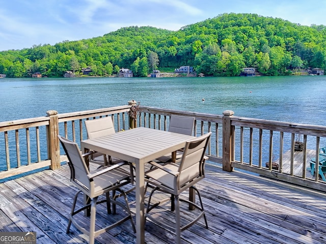165 Pepe Rd, Clayton, GA 30525 - dock area featuring a view of trees, a deck with water view, and outdoor dining space