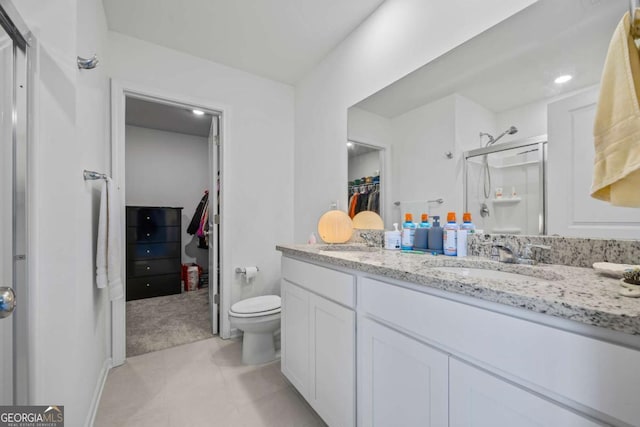 2942 Salinger Way, Gainesville, GA 30507 - full bathroom with a walk in closet, a shower stall, double vanity, and tile patterned flooring