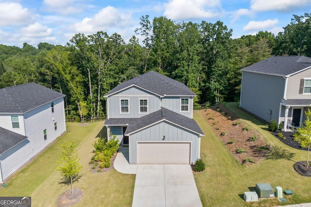 2942 Salinger Way, Gainesville, GA 30507 - view of front of house featuring board and batten siding, concrete driveway, a garage, a shingled roof, and a view of trees