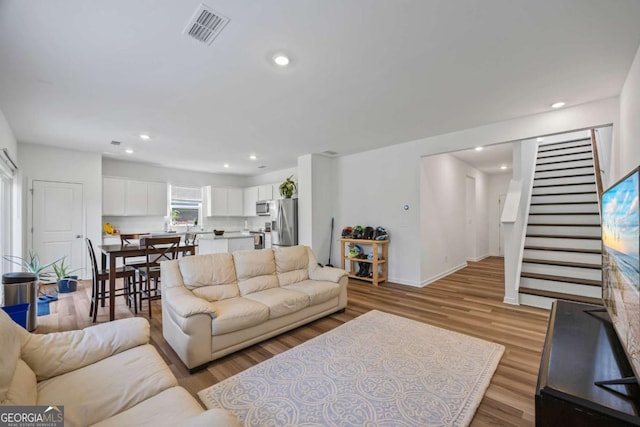 2942 Salinger Way, Gainesville, GA 30507 - living room with stairs, light wood finished floors, and recessed lighting