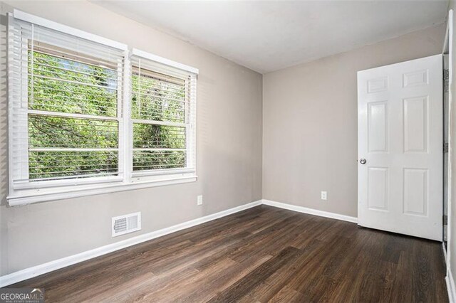 4009 Kirksford Dr, Decatur, GA 30035 - spare room with dark wood-style floors and baseboards