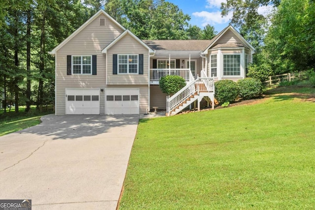 15 Miners Pt SE, Acworth, GA 30102 - view of front of home with a porch, a front yard, stairs, an attached garage, and driveway