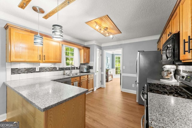 15 Miners Pt SE, Acworth, GA 30102 - kitchen featuring appliances with stainless steel finishes, plenty of natural light, tasteful backsplash, light wood-type flooring, and crown molding