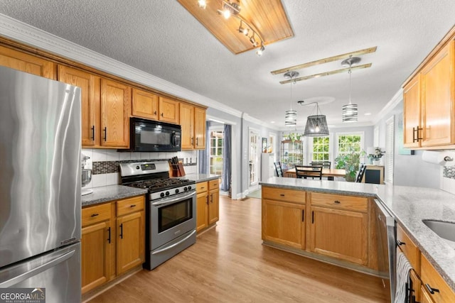 15 Miners Pt SE, Acworth, GA 30102 - kitchen with stainless steel appliances, ornamental molding, a peninsula, brown cabinetry, and light stone counters