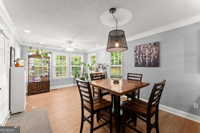 15 Miners Pt SE, Acworth, GA 30102 - dining room with ornamental molding, a textured ceiling, wood finished floors, ceiling fan, and recessed lighting