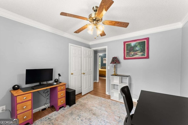 15 Miners Pt SE, Acworth, GA 30102 - home office with wood finished floors, ornamental molding, and a ceiling fan