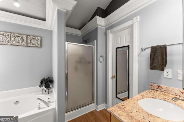 15 Miners Pt SE, Acworth, GA 30102 - bathroom featuring a shower stall, a garden tub, wood finished floors, vanity, and crown molding