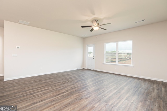1512 Big Bud Ln, Locust Grove, GA 30248 - spare room featuring dark wood-style flooring and a ceiling fan