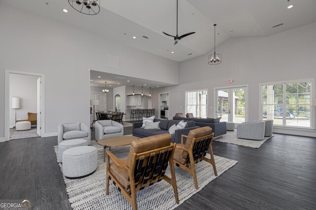 1512 Big Bud Ln, Locust Grove, GA 30248 - living room featuring a chandelier, high vaulted ceiling, dark wood-style floors, and recessed lighting