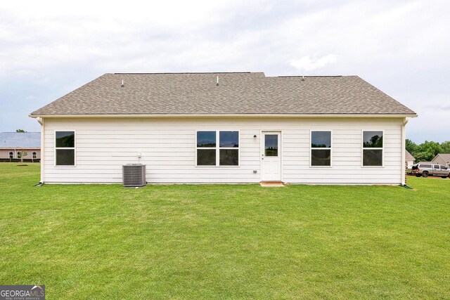 1512 Big Bud Ln, Locust Grove, GA 30248 - rear view of property with a lawn and roof with shingles
