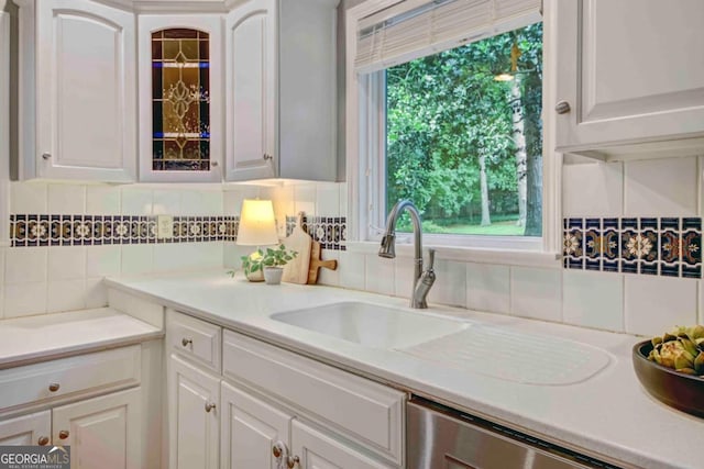 1693 Alderbrook Rd NE, Atlanta, GA 30345 - kitchen featuring dishwasher, decorative backsplash, and white cabinets