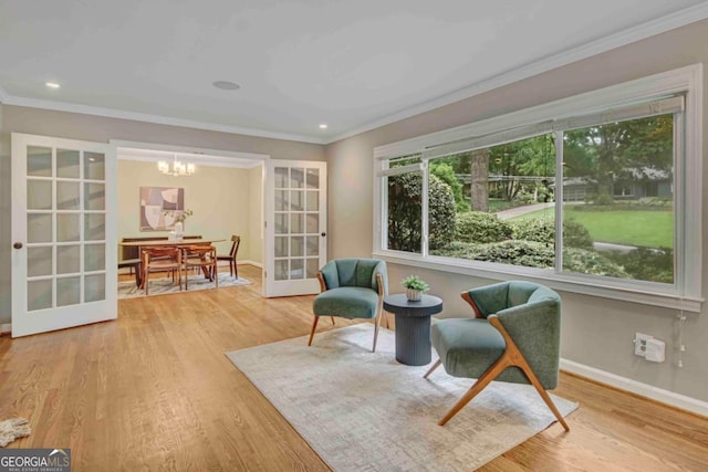1693 Alderbrook Rd NE, Atlanta, GA 30345 - sitting room with crown molding, a chandelier, wood finished floors, and recessed lighting