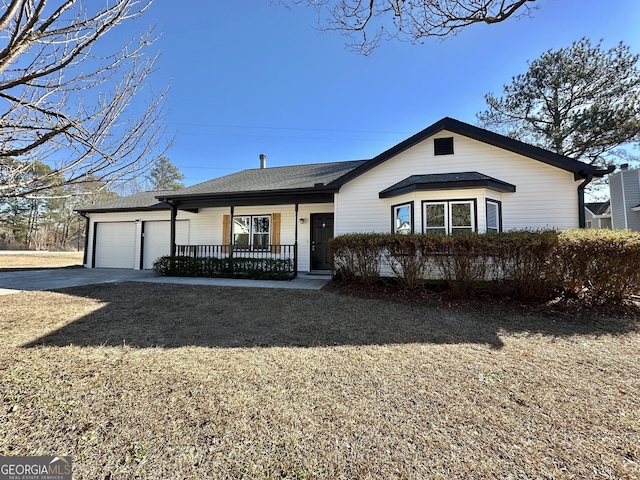 4035 Winchester Way, Loganville, GA 30052 - view of front of home with an attached garage, driveway, a porch, and roof with shingles