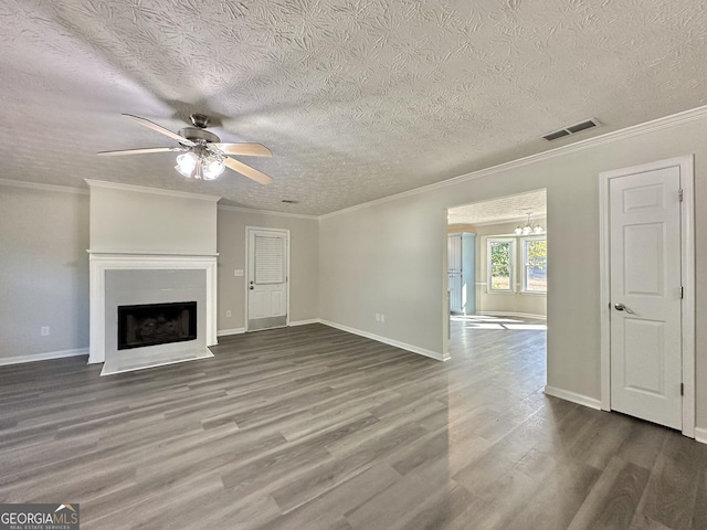 4035 Winchester Way, Loganville, GA 30052 - unfurnished living room featuring a ceiling fan, wood finished floors, a fireplace with flush hearth, ornamental molding, and a textured ceiling