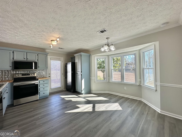 4035 Winchester Way, Loganville, GA 30052 - kitchen featuring electric stove, freestanding refrigerator, ornamental molding, a chandelier, and dark wood-style flooring