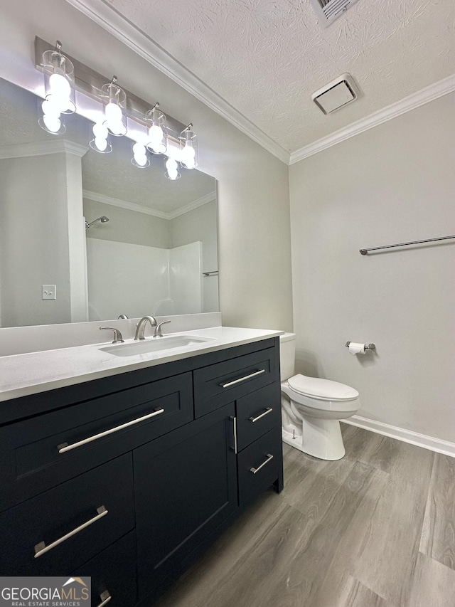4035 Winchester Way, Loganville, GA 30052 - bathroom featuring wood finished floors, vanity, ornamental molding, and a textured ceiling
