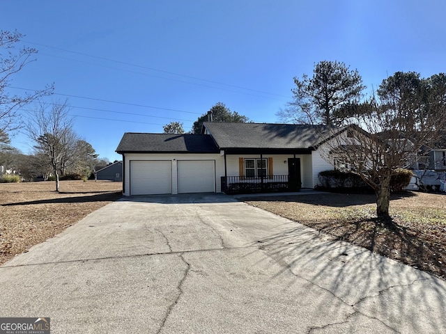 4035 Winchester Way, Loganville, GA 30052 - ranch-style house with a porch, an attached garage, and concrete driveway