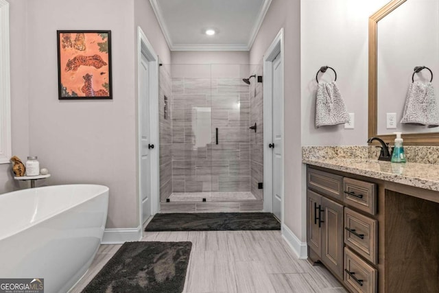 1118 Coralbell Dr, Statham, GA 30666 - full bath featuring a stall shower, a soaking tub, vanity, crown molding, and recessed lighting