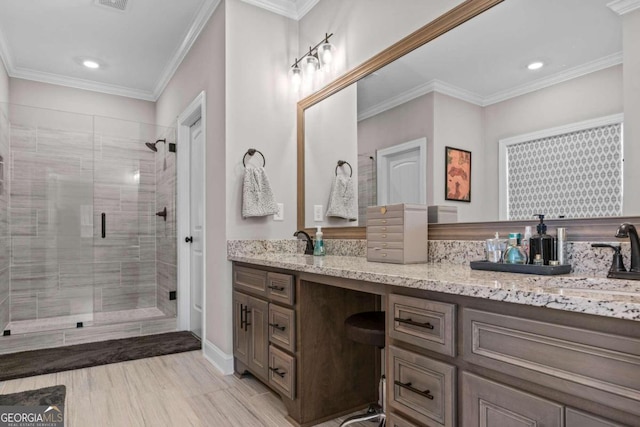 1118 Coralbell Dr, Statham, GA 30666 - full bath with double vanity, a shower stall, recessed lighting, and crown molding