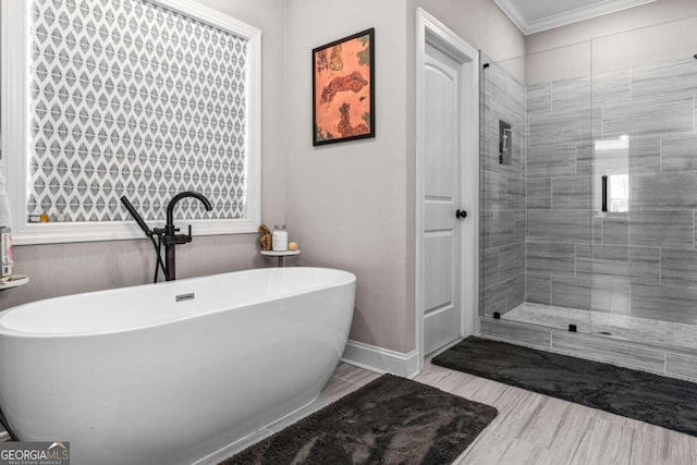 1118 Coralbell Dr, Statham, GA 30666 - full bath with a freestanding tub, ornamental molding, and a shower stall