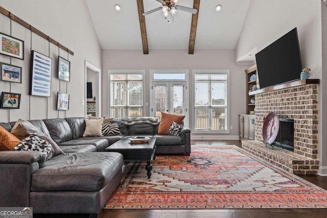 1118 Coralbell Dr, Statham, GA 30666 - living area with wood finished floors, ceiling fan, recessed lighting, a fireplace, and beam ceiling