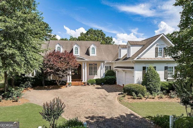 2052 Trimleston Rd, Statham, GA 30666 - new england style home with a garage, decorative driveway, and a standing seam roof